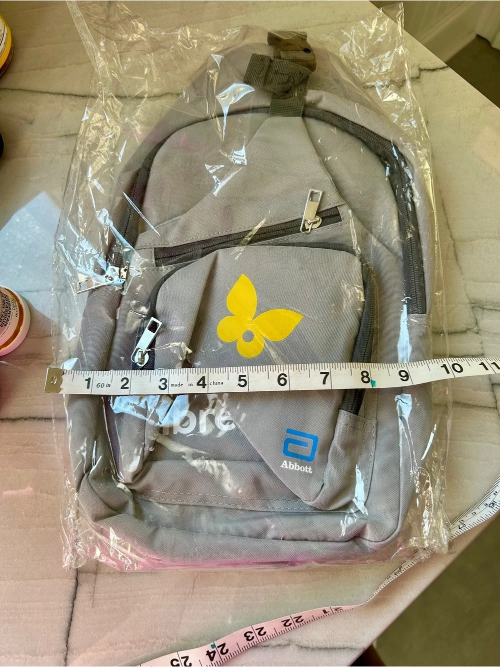 Sling backpack- gray, sponsored by Libre from Abbott.